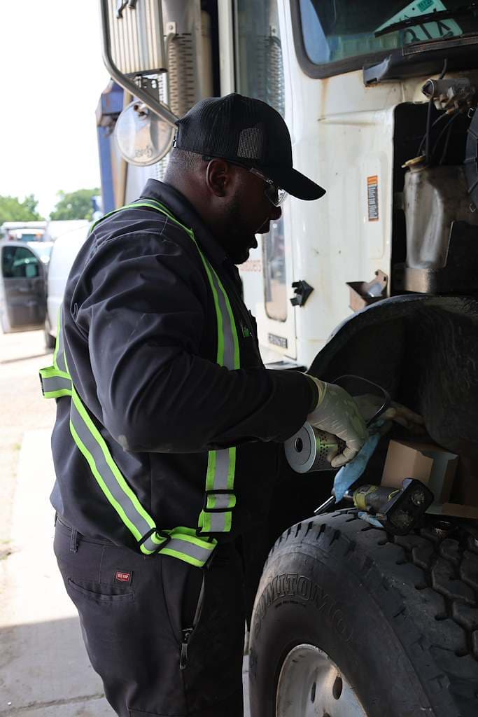 Port City Repair technician servicing a truck brake and wheel end