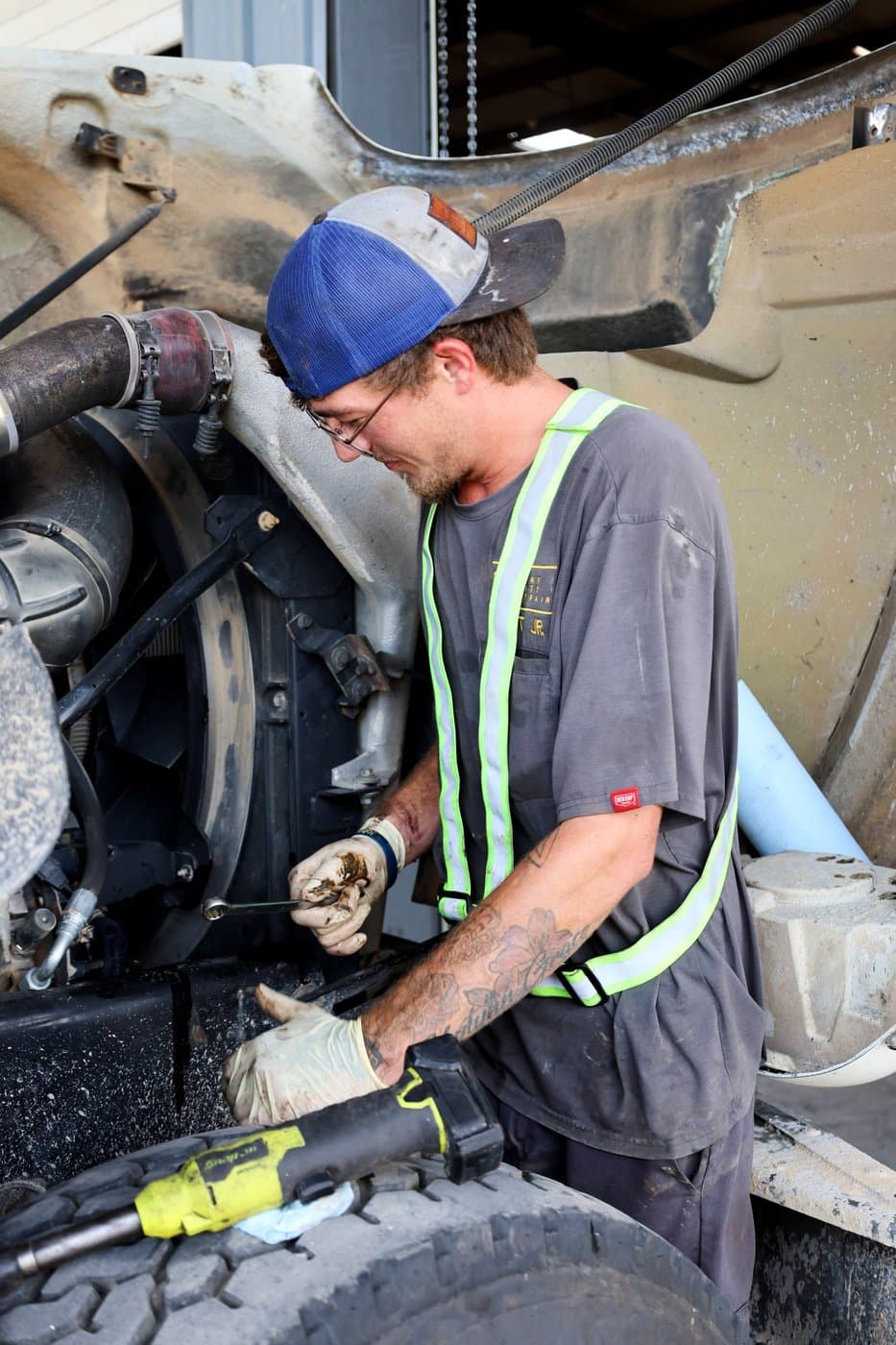 Port City Repair technician diagnosing a diesel truck engine
